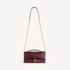 Bolso de mano de mujer con forma de Hourglass y cadena en color burdeos oscuro Bolso de mano de mujer con forma de Hourglass y cadena en color burdeos oscuro