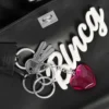 Bolso de mano «Rodeo» pequeño para mujer con colgantes, en negro Bolso de mano «Rodeo» pequeño para mujer con colgantes, en negro