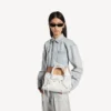 Bolso «Le City» para mujer, pequeño, con tachuelas gigantes y pedrería, en blanco óptico Bolso «Le City» para mujer, pequeño, con tachuelas gigantes y pedrería, en blanco óptico