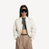 Chaqueta bomber corta de mujer en color marfil Chaqueta bomber corta de mujer en color marfil
