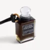 Colgante con frasco de perfume en miniatura en color negro Colgante con frasco de perfume en miniatura en color negro