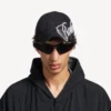 Gorra de hombre «Cursive» en negro desgastado
