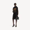 Sudadera con capucha Balenciaga Sacra Cœur de corte medio para mujer, en color negro Sudadera con capucha Balenciaga Sacra Cœur de corte medio para mujer, en color negro